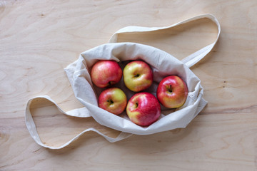 Five delicious fresh apples in a bag