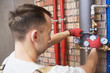 © Kadmy - plumber installing and mounting water equipment - meter, filter and pressure reducer