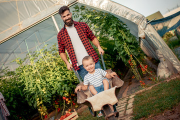 Father and son having fun in garden