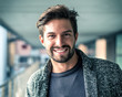 © theartofphoto - One handsome young man in urban setting in European city, standing and smiling to camera happy