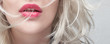Close-up red plump lips of a young blonde woman on a white background. Cosmetology and plastic surgery banner