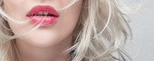 Close-up Red Plump Lips Of A Young Blonde Woman On A White Background. Cosmetology And Plastic Surgery Banner