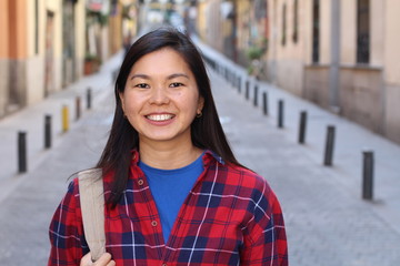 Wall Mural - Foreign female student outdoor close up 