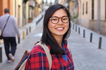 Wall Mural - Contemporary Asian woman looking happy 