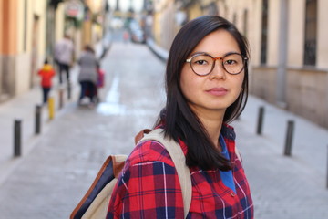 Wall Mural - Determined Asian woman outdoors close up 