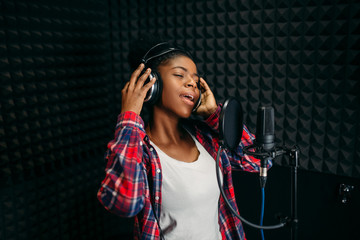 Wall Mural - Female singer songs in audio recording studio