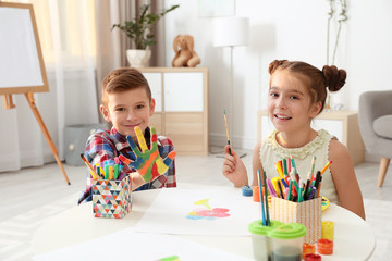 Poster - Little children painting hands at table indoors