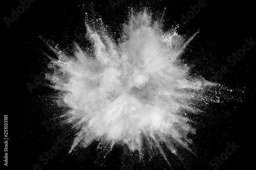 Fotografía White powder explosion isolated on black background