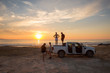 © pha88 - A group of friends at sunset near the car.Summer vacation with friends