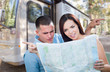 © Andy Dean - Young Lost and Confused Military Couple Looking at Map In Front of RV