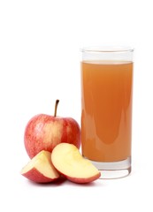 apple juice - sliced ​red apples and a glass of naturally cloudy apple juice in front of white background