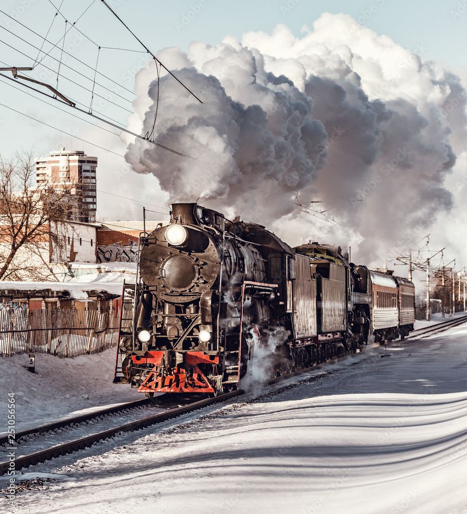 Steam train moves toward. - obrazy, fototapety, plakaty 