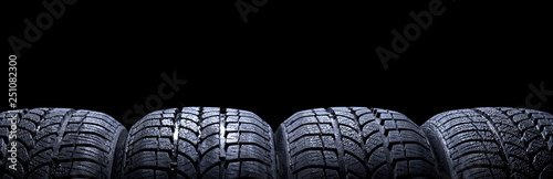 Photographie Car tires isolated on black background