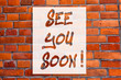 © Zofia - Handwriting text writing See You Soon. Concept meaning Farewell we will meet again in a short period of time Brick Wall art like Graffiti motivational call written on the wall