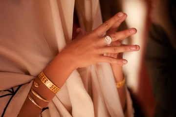 beautiful roman women's hands with ancient jewelry