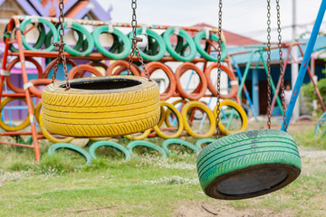 Playground built with old tires for children plays. Recycling old tires