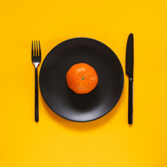 Poster - Tangerine in black plate on yellow