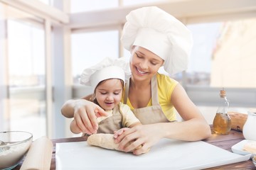 Sticker - Portrait of adorable little girl and her mother baking together