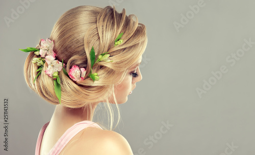 Beautiful Model Girl With Elegant Hairstyle And Rose Flowers In A