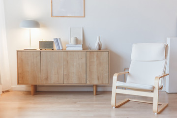 Living interior with cabinet and armchair