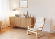 © vladdeep - Modern minimalistic interior with chest of drawers an braided armchair. Scandinavian style.