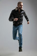 © Viorel Sima - man in leather jacket and jeans jumping