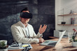 © kerkezz - Businessman using virtual reality headset