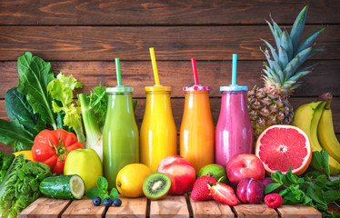 Wall Mural - Colorful freshly squeezed fruits and vegetables smoothies with ingredients for healthy eating