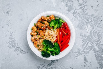 Wall Mural - Teriyaki Chicken buddha bowl lunch with rice, broccoli and red bell pepper