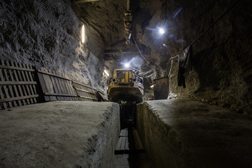 Wall Mural - Underground gold ore mine shaft tunnel gallery passage with load, haul, dump machine LHD