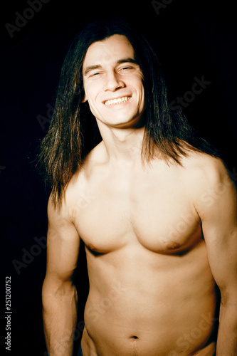 Handsome Young Man With Long Hair Naked Torso On Black Background