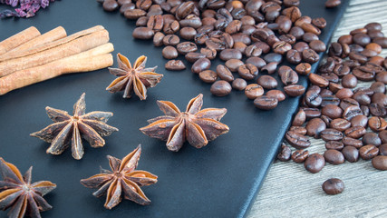 Cinnamon sticks, star anise and coffee beans. Spices and food on wooden background. Ingredients for the restaurant