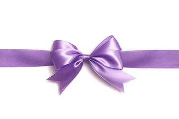 Lilac bow and ribbon on a white background