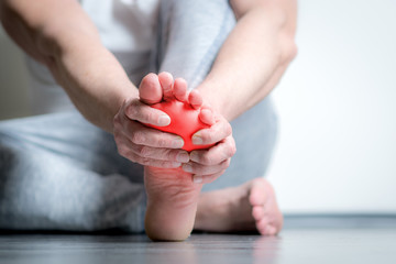 man with pain in foot