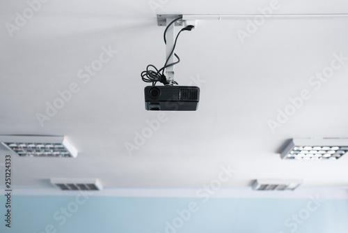 Black Projector On A Ceiling In A Classroom Buy This Stock