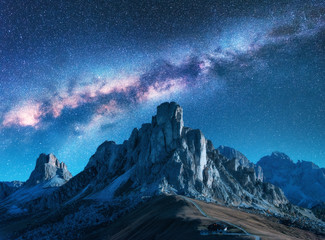 Wall Mural - milky way above mountains at night in summer. landscape with alpine mountain valley, blue sky with m