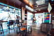 © jakkapan - Blurred background image of coffee shop. abstract blur background with people in cafe. vintage color tone style