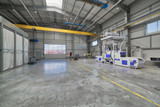 Fototapeta Przestrzenne - Interior of a modern factory. A bright large workshop, inside there is a shot blasting unit