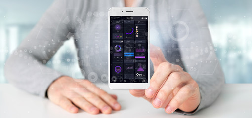 Poster - Businessman holding Smartphone with user interface data on the screen isolated on a background