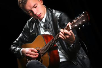 Wall Mural - Young men playing the guitar