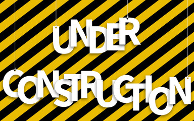 Wall Mural - Under Construction text hanging on ropes on a yellow and black background