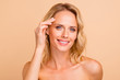 Lifting therapy treatment concept. Close-up portrait of her she attractive cheery wavy-haired nude lady with flawless perfect smooth pure shine skin touching forehead isolated over beige background