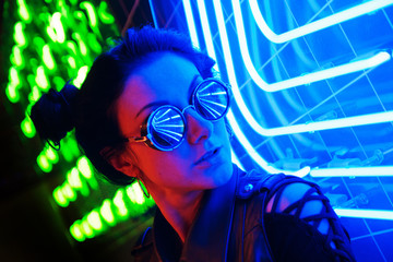 Cinematic night portrait of girl and neon lights