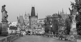 Fototapeta Miasto - Prague - The Castle and Cathedral and st. Nicholas church from Charles Bridge in the morning dusk.