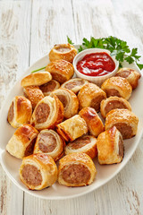 Wall Mural - freshly baked Puff pastry Sausage rolls, close-up