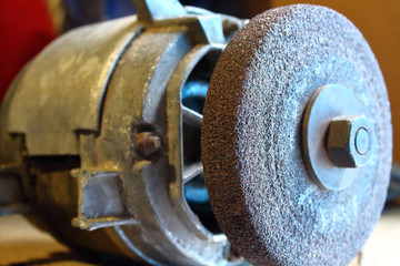 Old grinding machine. Close-up. Background.