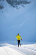 © lightpoet - Cross-country skiing: young man cross-country skiing on a winter day
