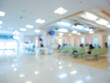 Blur image Background of people in clinic lobby hall at modern hospital to pay money for medical expenses.