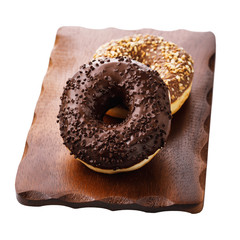 Two chocolate donuts on a stand isolated on white background