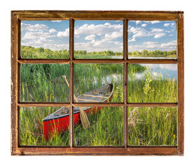 Wall Mural - canoe on lake shore - window view